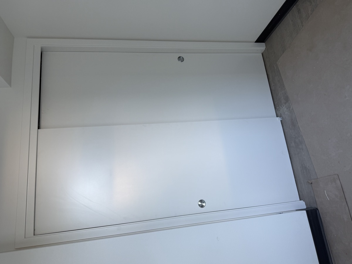 White bypass sliding closet doors installed in a finished room