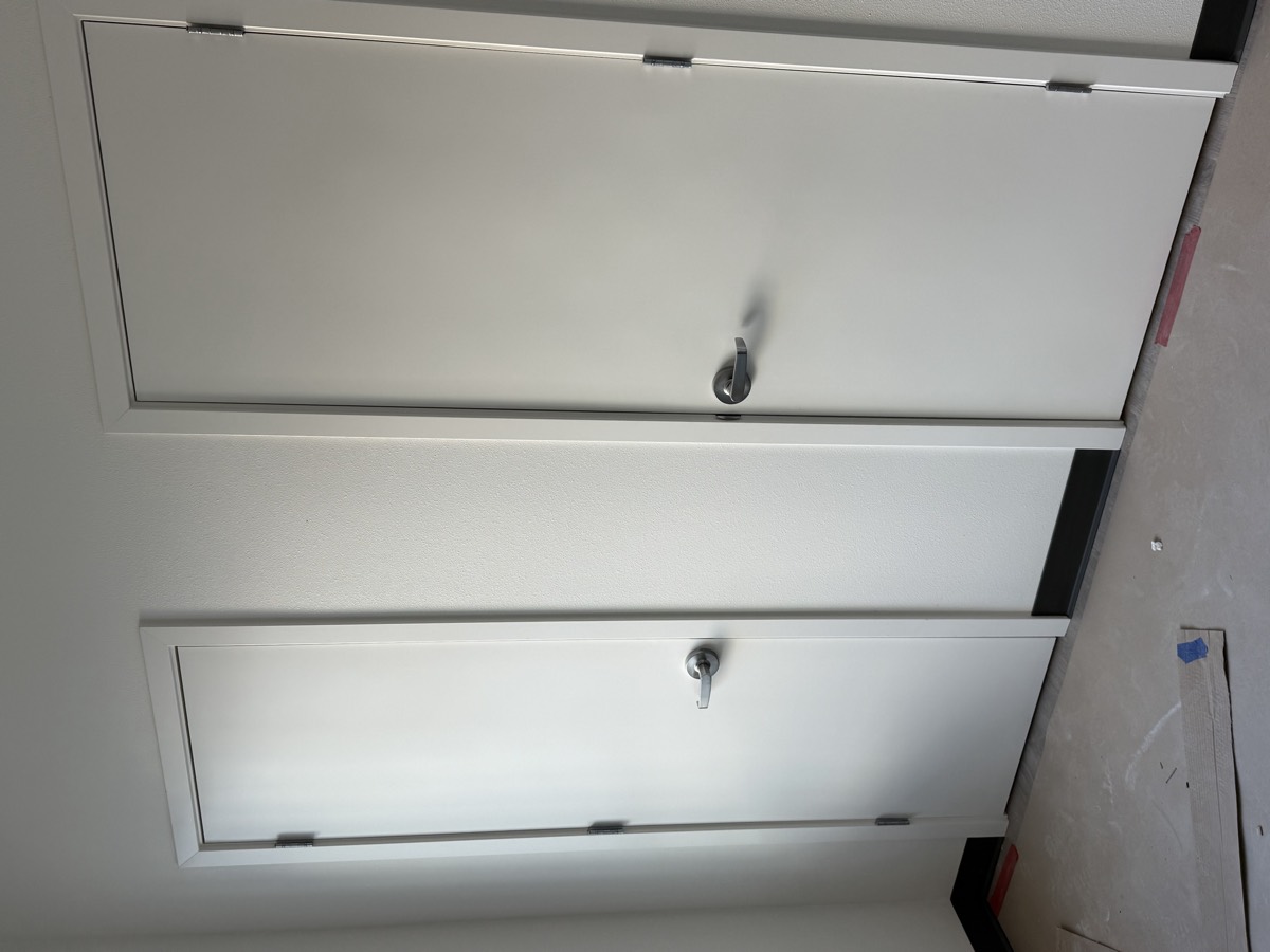 Painted flush passage doors with lever hardware installed